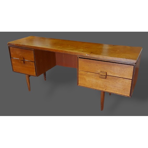 390 - Kofod Larsen for G-Plan a Circa 1960's desk with four drawers raised upon turned legs, 158cms wide, ... 