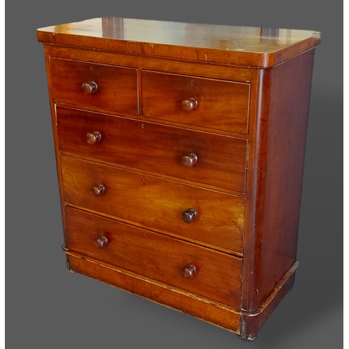 391 - A Victorian mahogany chest of two short and three long drawers with knob handles raised upon low bal... 