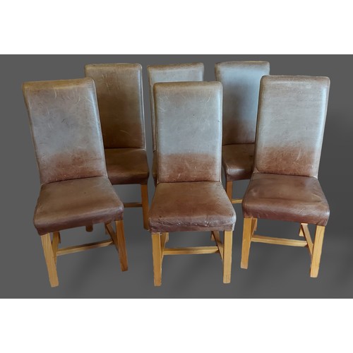 392 - A set of six contemporary high back dining chairs in beige leather