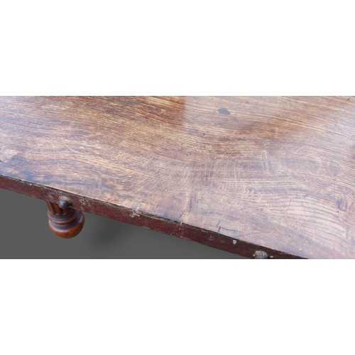 393 - A 19th Century Pollard oak dining table by Gillow and Co. the moulded top above a plain frieze raise... 