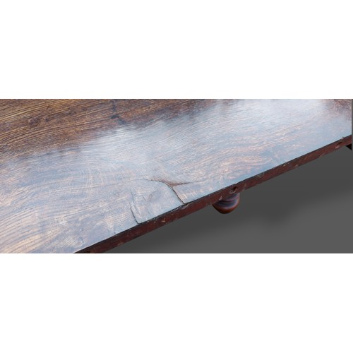 393 - A 19th Century Pollard oak dining table by Gillow and Co. the moulded top above a plain frieze raise... 