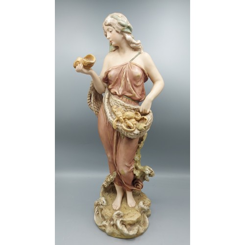 13 - A Royal Dux figure in the form of a Classical figure collecting shells, 46cms