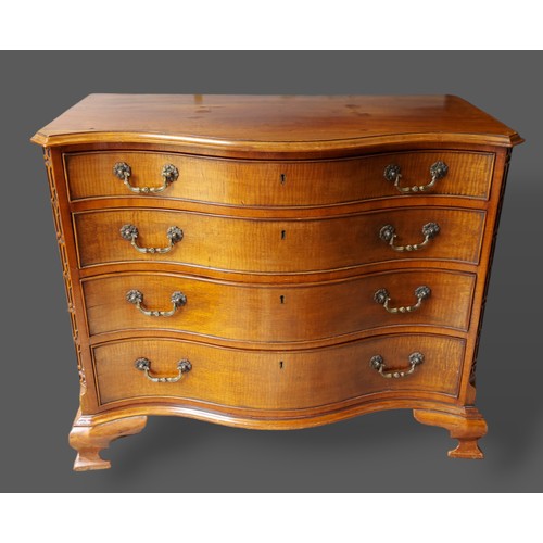 415 - A late 19th Century mahogany Serpentine chest, the moulded top above four drawers with brass handles... 