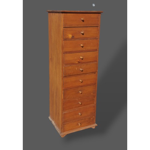 419 - A hardwood Tall chest, the moulded top above ten drawers with knob handles, raised upon low feet, 47... 