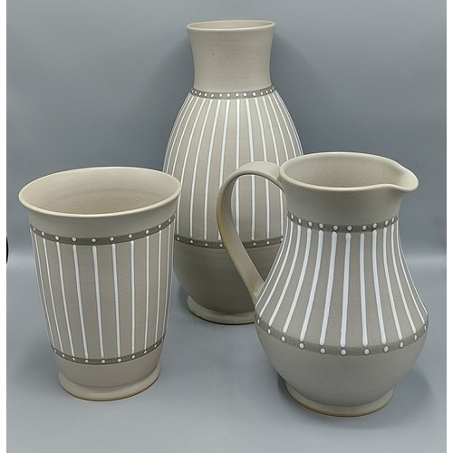 3 - A Bourne Denby vase, 34cms tall, together with a matching vase and jug