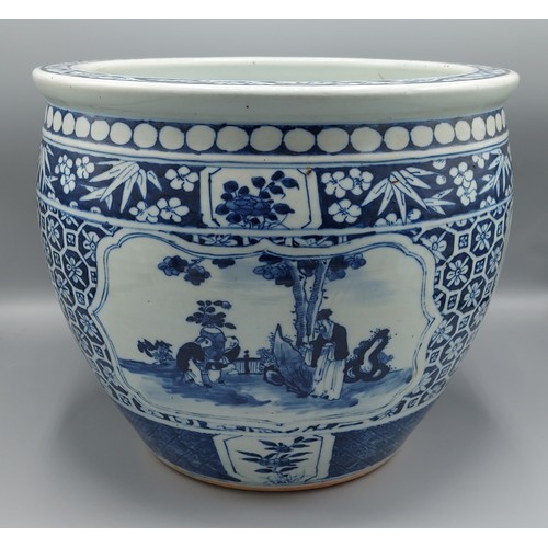 6 - A Chinese jardiniere decorated underglaze blue with reserves depicting figures within landscapes, 25... 