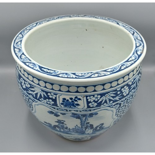 6 - A Chinese jardiniere decorated underglaze blue with reserves depicting figures within landscapes, 25... 