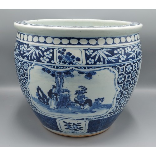 6 - A Chinese jardiniere decorated underglaze blue with reserves depicting figures within landscapes, 25... 