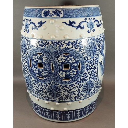 10 - A Chinese garden seat of barrell form decorated in underglaze blue with reserves depicting figures, ... 