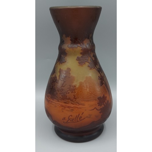 22 - Émile Gallé  a cameo glass vase decorated with a landscape and trees, signed Galle, 16.5cms tall