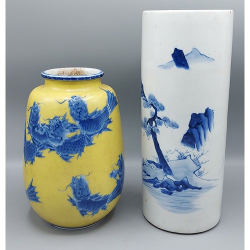 52 - A Chinese porcelain vase decorated in underglaze blue on yellow ground, seal mark to base, 22cms tog... 