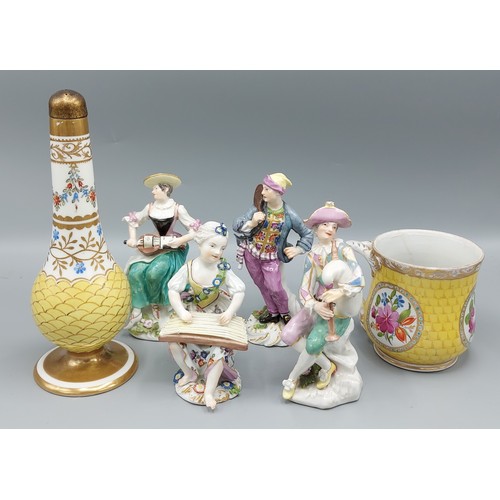 62 - A group of four Dresden porcelain figures together with a Dresden porcelain mug and a similar bottle... 