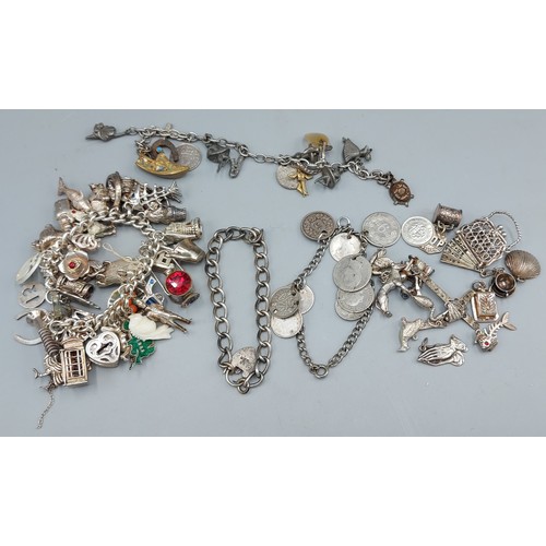 280 - Two silver Charm bracelets together with various loose charms and a coin set bracelet