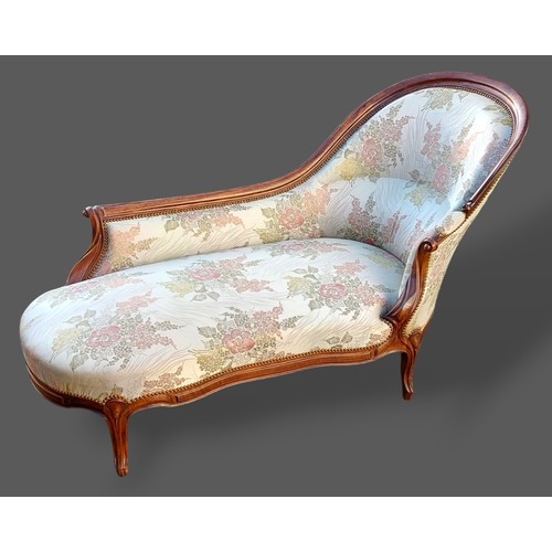 207 - A 19th Century French Chaise Lounge with a shaped spoon end raised upon carved cabriole legs with sc... 