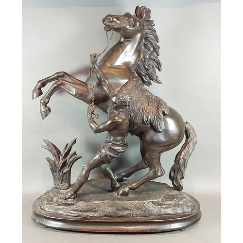 136 - A 19th Century patinated spelter large Marley horse group, 64cms tall