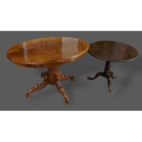 211 - A 19th Century French centre table of oval form together with a George III oak pedestal table