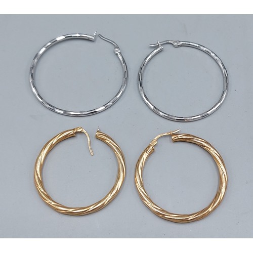 84 - A pair of 9ct gold hoop earrings, 1.7gms together with a pair of 14ct white gold hoop earrings, 3.5g... 