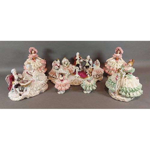 8 - A German porcelain group, The Musicians together with a collection of six similar groups and figures