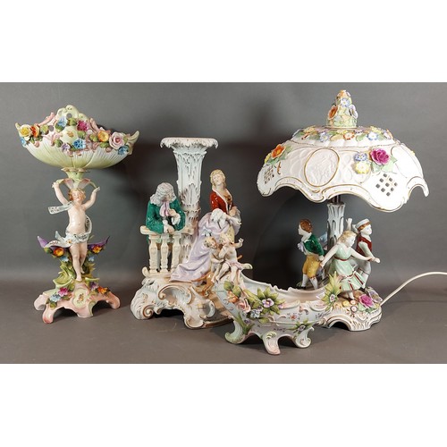 11 - A German porcelain figural table lamp together with a collection of similar ceramics