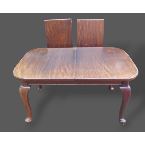 231 - A mahogany wind out extending dining table by Selbat, the moulded top above cabriole legs with pad f... 