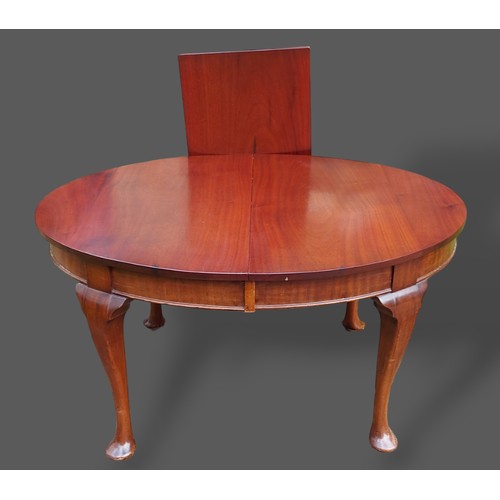 234 - A mahogany wind-out extending dining table with a plain frieze raised upon cabriole legs with pad fe... 