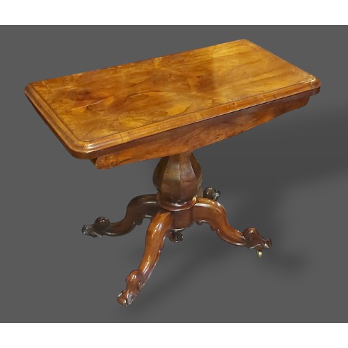 238 - A William IV Rosewood card table, the hinged top above an octagonal baluster column raised upon four... 