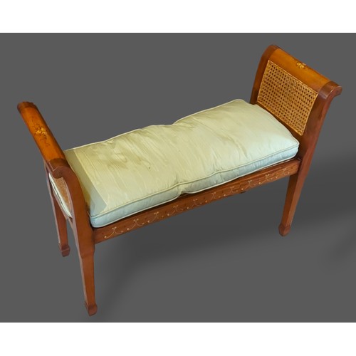 257 - A 20th Century Sheraton style window seat with double caned ends raised upon square tapering legs wi... 