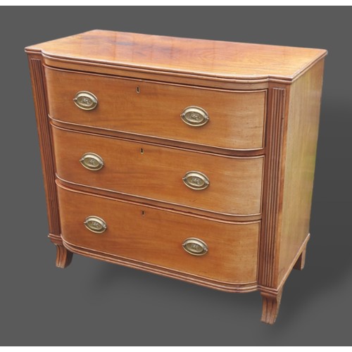 258 - A Regency mahogany semi bow fronted chest, the reeded top above three drawers with oval brass handle... 