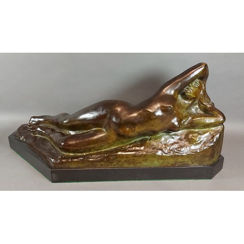 174 - Eugene Canneel, a patinated bronze model of a female nude with marble base, signed, 55cms long, 25cm... 