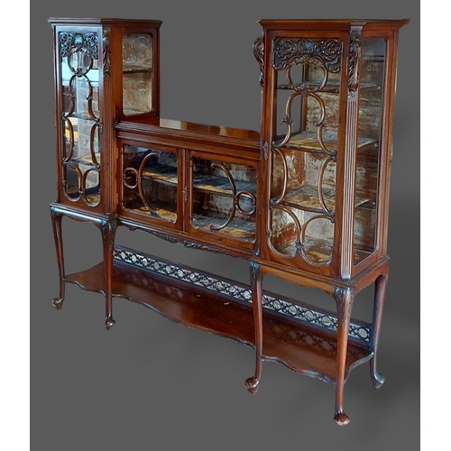 273 - A Victorian mahogany display cabinet with two pedestals and four scroll bar glazed doors enclosing s... 