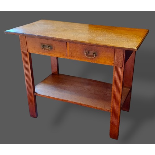 277 - An Arts and Crafts oak side table with two frieze drawers above an undertier, 112cms wide, 57cms dee... 