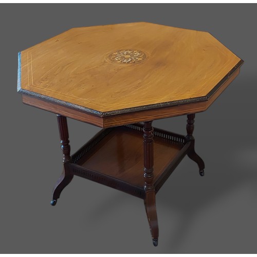 279 - A Victorian Rosewood and marquetry inlaid octagonal centre table, the moulded top with central inlay... 