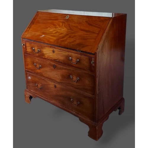 284 - A 19th Century mahogany bureau, the fall front enclosing a fitted interior above three long drawers ... 