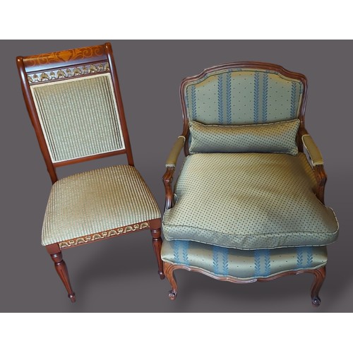 255 - A French Fauteil with an upholstered back and seat raised upon cabriole legs with scroll feet togeth... 