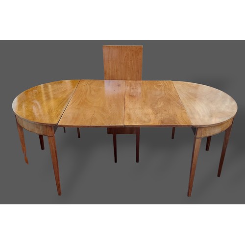 219 - A Regency mahogany dining table with two D-ends and three leaves