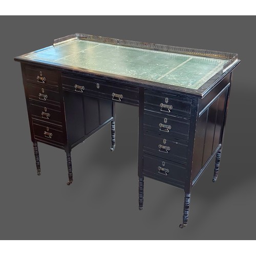 222 - A Victorian ebonised writing desk by Wilkinson and Son, 8, Old Bond Street, London, the brass galler... 