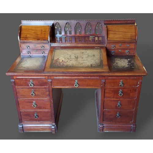 227 - A 19th century mahogany twin pedestal desk, the superstructure with gothic tracery and four small dr... 