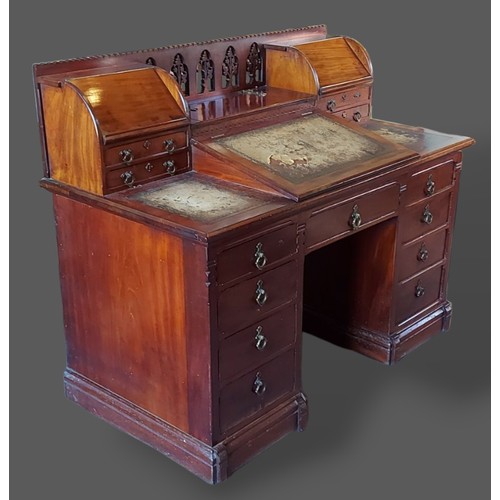 227 - A 19th century mahogany twin pedestal desk, the superstructure with gothic tracery and four small dr... 