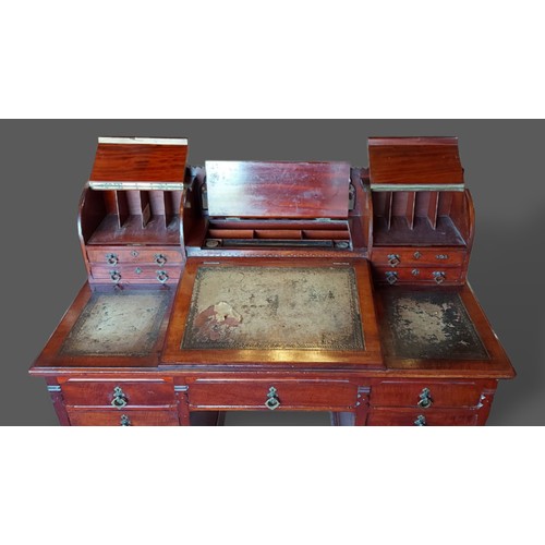 227 - A 19th century mahogany twin pedestal desk, the superstructure with gothic tracery and four small dr... 