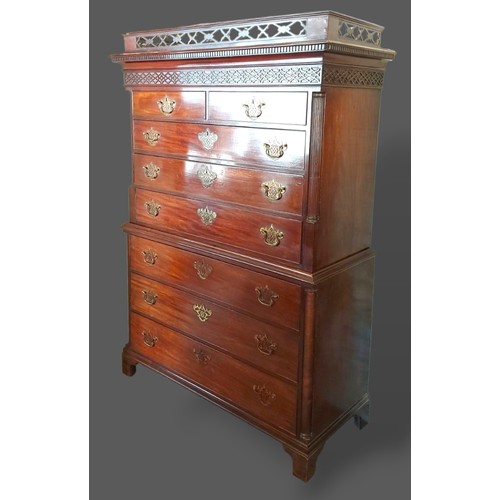 228 - A Regency mahogany chest on chest with a pierced gallery above a moulded cornice, the blind fretwork... 