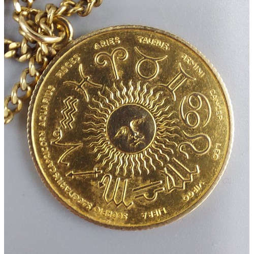 76 - A 9ct gold pendant, signs of the Zodiac together with a 9ct gold linked chain, 11.2gms
