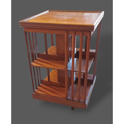 237 - An Edwardian mahogany revolving bookcase, 81cms tall