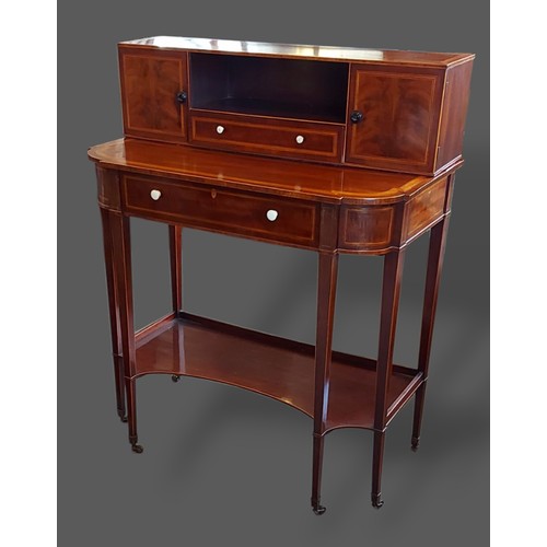 243 - An Edwardian mahogany satinwood inlaid writing table by Gillows of Lancaster, the superstructure wit... 