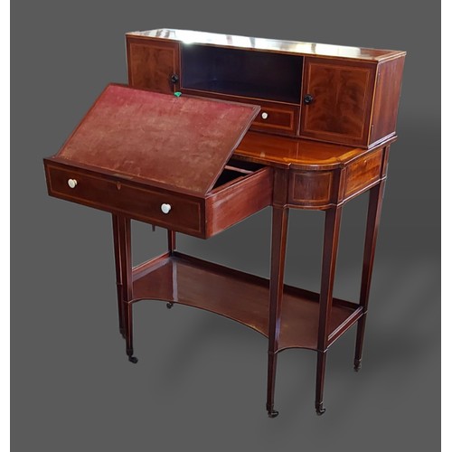 243 - An Edwardian mahogany satinwood inlaid writing table by Gillows of Lancaster, the superstructure wit... 