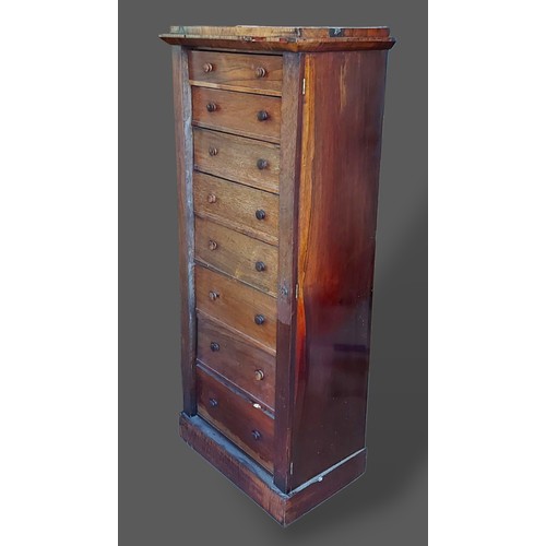 248 - A Victorian Rosewood Wellington chest with eight drawers flanked by locking mechanism raised upon a ... 