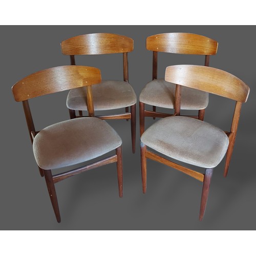 252 - Bramin, Denmark, a set of four dining chairs with shaped backs and upholstered seats with turned leg... 