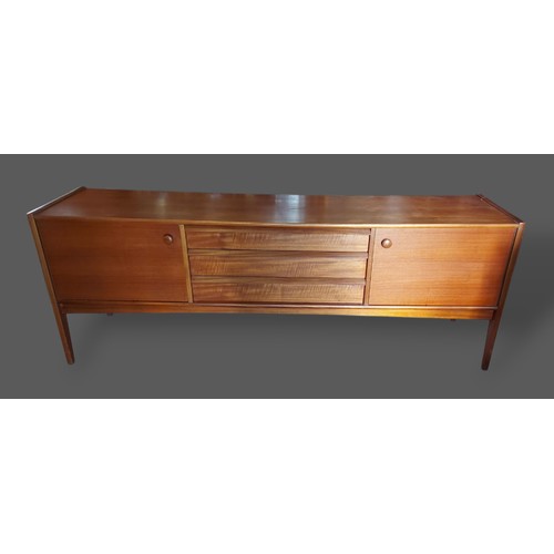 253 - A. Younger, Da Sliva sideboard with three central drawers flanked by cupboard doors raised upon turn... 