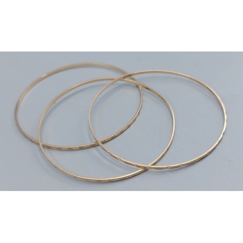 88 - Three 9ct gold bangles, 8.8gms
