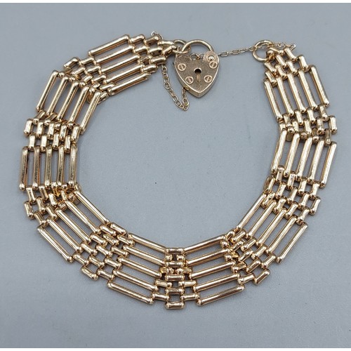 89 - A 9ct gold gate link bracelet with padlock clasp, 9.4gms