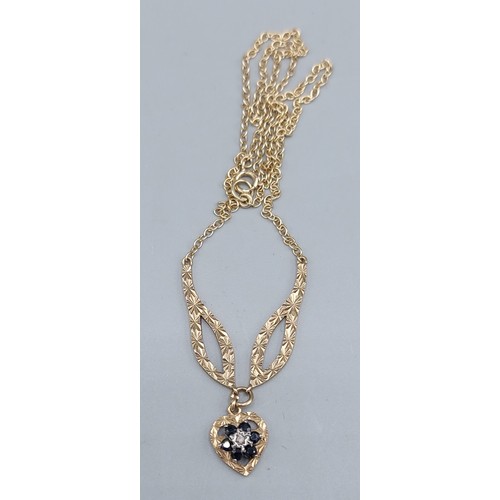 92 - A 9ct gold necklace, the heart form pendant set with Diamonds and Sapphires with fine link chain, 4.... 
